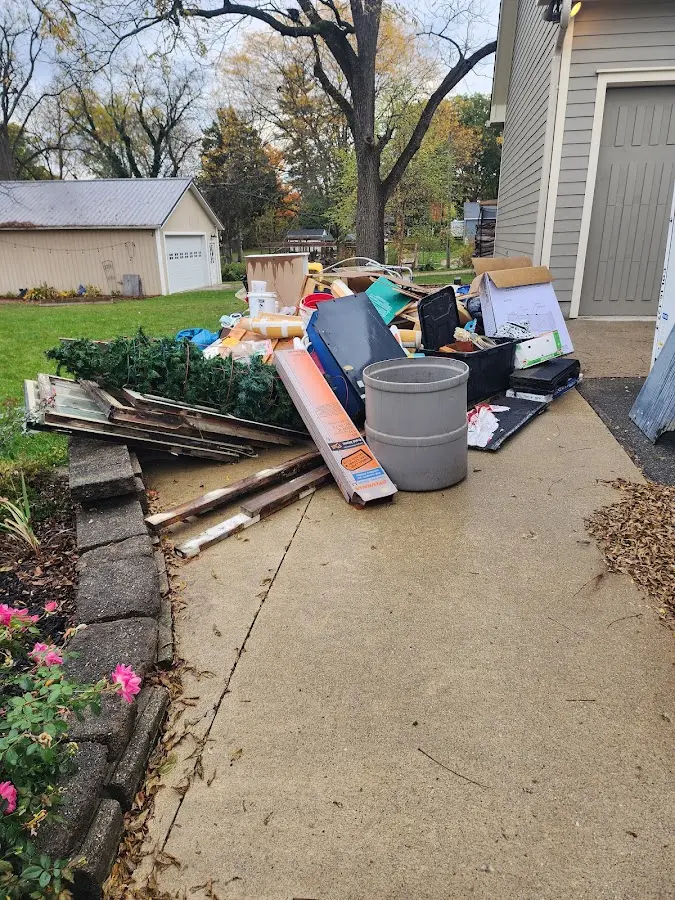 Dumpster being loaded with debris for Estate Cleanout Dumpster Rental in South Monrovia Island